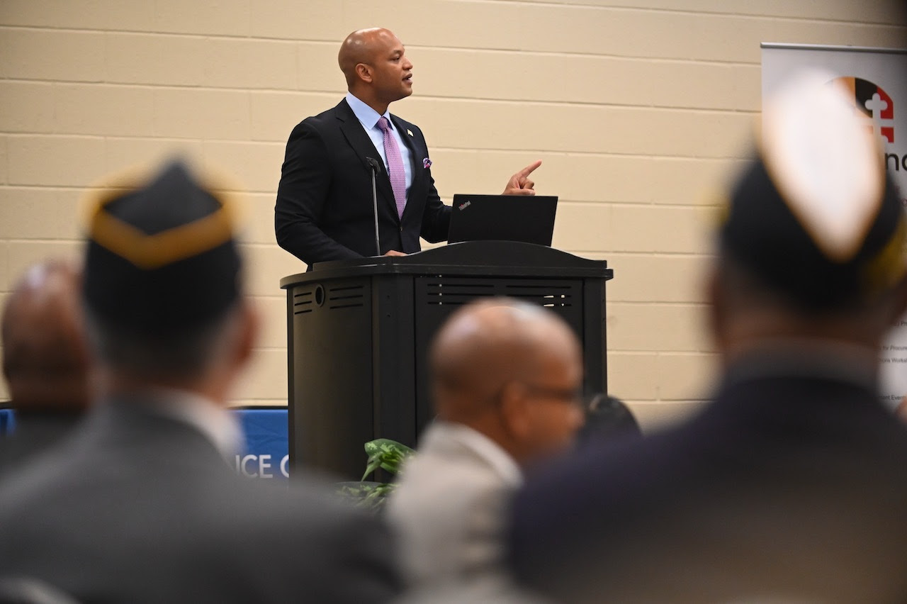 Governor Wes Moore on the podium addressing veterans