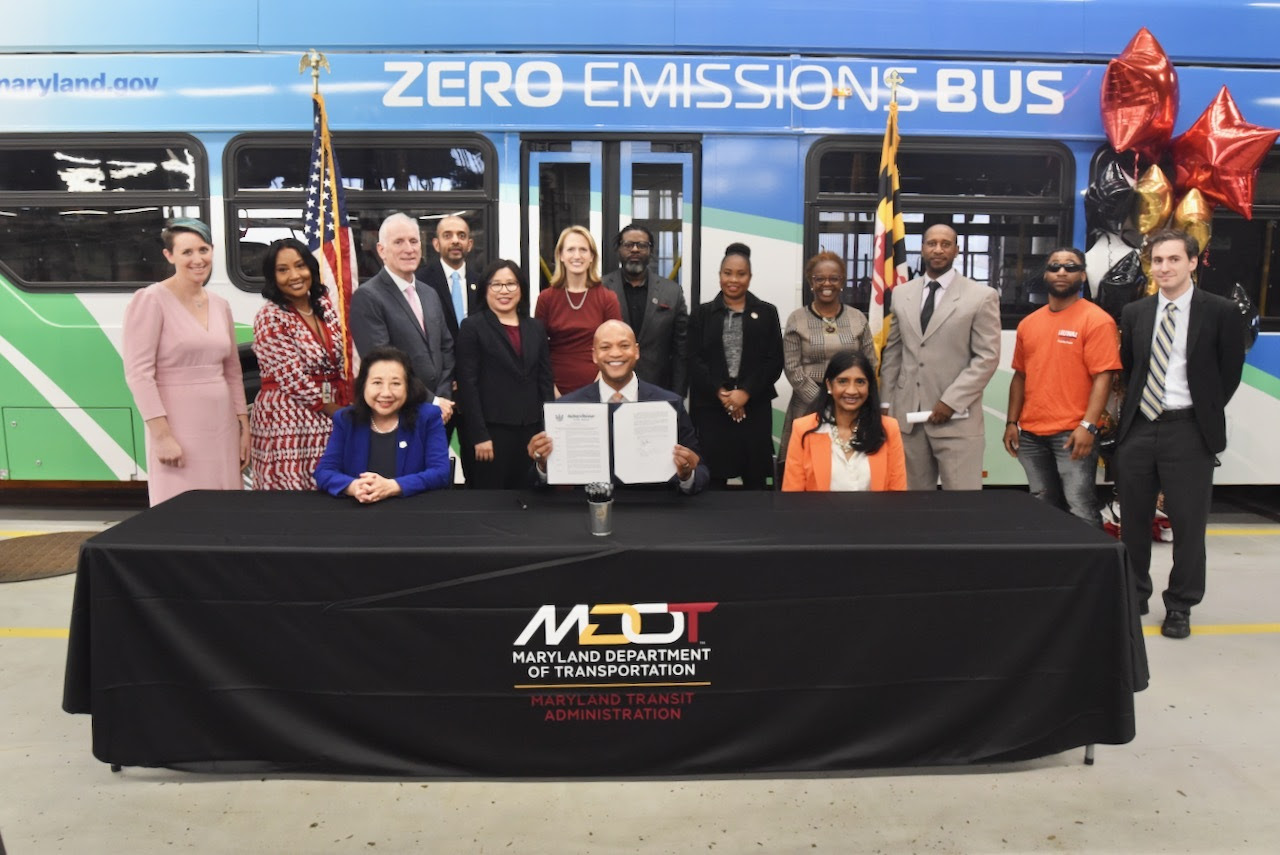 Governor Moore signs executive order at the MTA Eastern Division