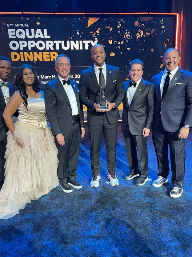 Governor Moore stands with the President's Award at the National Urban League's Annual Equal Opportunity Dinner in New York City.