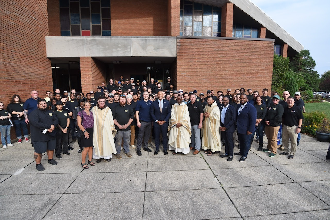 Governor Moore last Thursday attended the annual Labor Day mass at St. Camillus Church in Silver Spring with 150 union members representing the International Brotherhood of Electrical Workers Local 24, Steamfitters Local 602, and the Montgomery County Police Department.