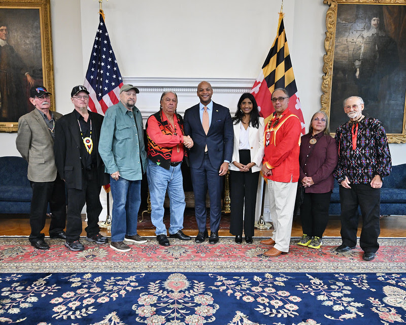 Governor Moore and Lieutenant Governor Miller stand in the Governor's Reception Room with Maryland Tribal Community members.
